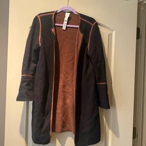 Chico’s tan and black sweater topper.